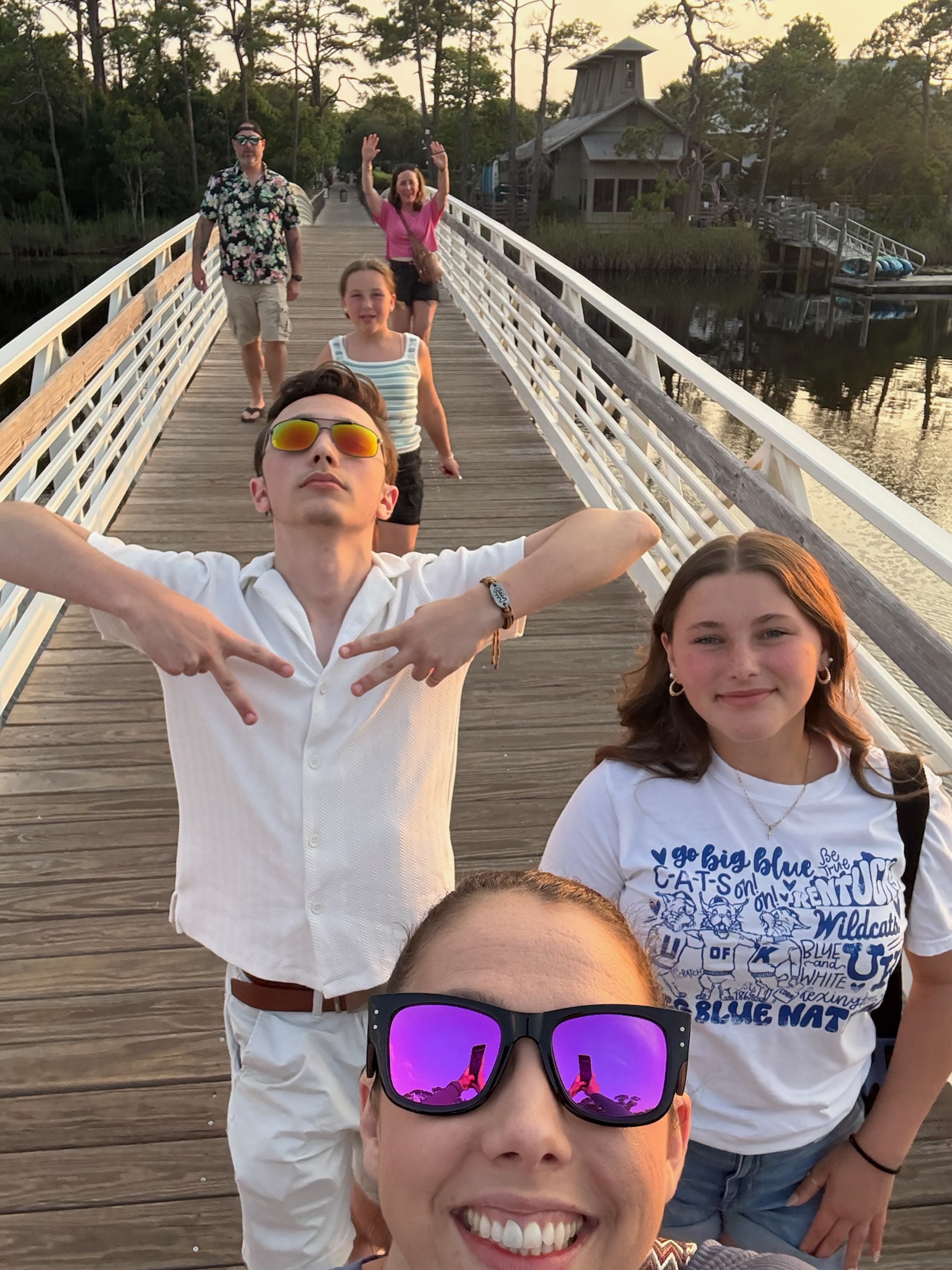 Photo of the Lobuglio's and friends on a bridge over a lake.