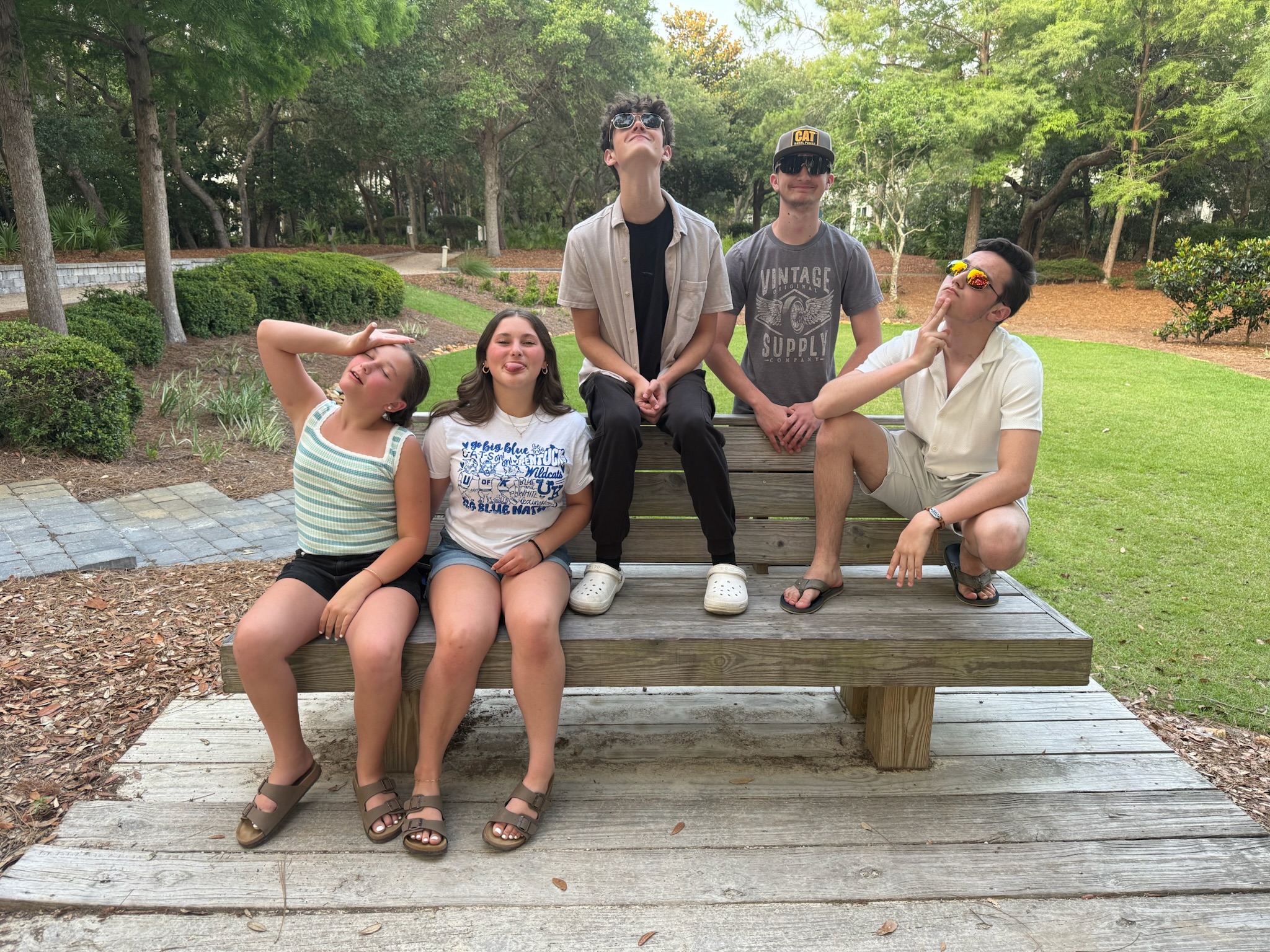 Photo of the LoBuglio and and family friend's children on a bench.